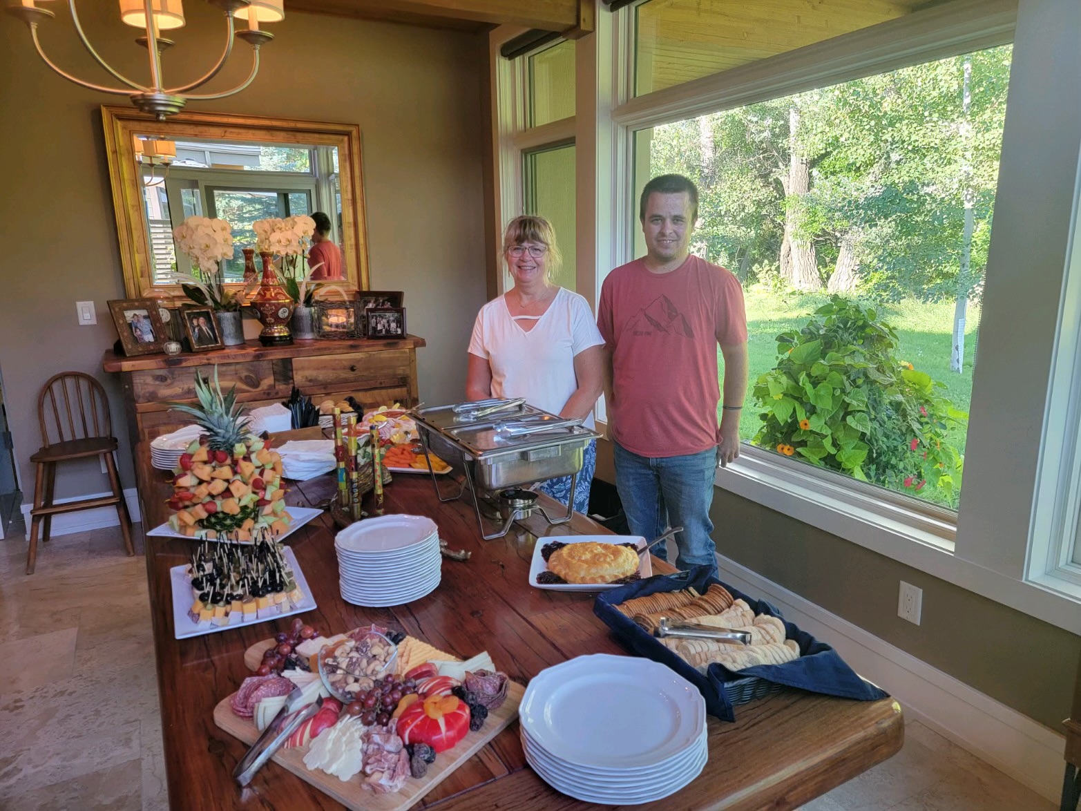 Laurie and her crew beside a buffet they catered